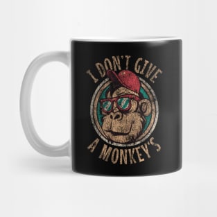 I don't give a monkey's. Laid back cool. Aged and distressed. Mug